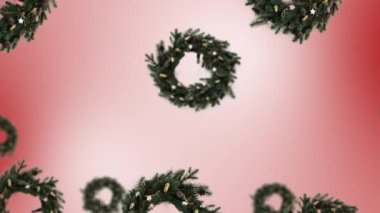 Değişik çaplara sahip bir Noel çelengi dekoru eğilim renk eğimine sahip. 4K UHD görüntüsü.
