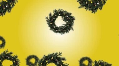 Farklı çaplarda bir Noel çelengi dekoru 4K UHD görüntülerinde sarı renk gradyanı (yatay, döngü dışı) eğiliminde. 