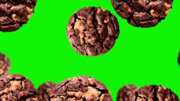 Flying Dark Chocolate Chip Cookie Different Diameters Green Screen Isolated — Stock Video
