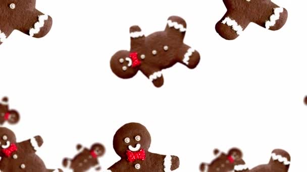 ジンジャーブレッドマンのストリーム 白い色の背景に異なる直径のクリスマスジンジャーブレッド Uhd映像 未来的なデザイン モーションデザインアニメーション ポップアートデザイン 創造的なクリスマススイーツのフードコンセプト — ストック動画