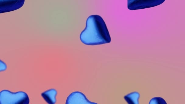 一个心形包裹着巧克力蓝色糖果飞舞 在趋势的粉色渐变背景上摇曳 甜食概念 爱母亲节的模板 4K糖果镜头 — 图库视频影像
