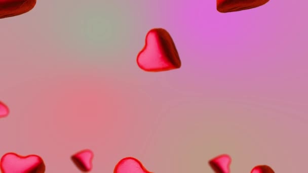心形包裹着巧克力糖 在趋势的粉色渐变背景上摇曳着不同直径的摆动 圣瓦伦丁节 生日和其他假日的概念 — 图库视频影像