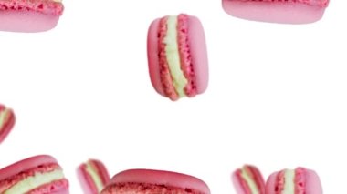 Tatlı pembe badem kurabiyeleri uçuyor ve beyaz renkli arka planda sallanıyor. Fransız Makarna Kurabiyesi tatlı bir krema bazlı şekerdir. Sevgililer günü, randevu, düğün, aşk hediyesi. Romantik aşk konsepti 