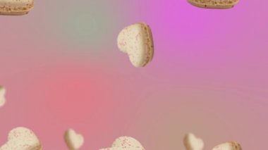 Minimum hareket dizaynı 4k yiyecek animasyonu. Makarna veya pembe kalp şekilli Fransız badem kurabiyesi trend renk arkaplanında sallanır ve hareket eder. Yüksek kalite 4K tatlı yemek görüntüsü. Sevgililer Günü kızı