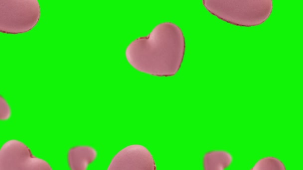 Zoete Makaken Roze Hartvorm Vliegen Wiebelen Geïsoleerde Achtergrond French Macarons — Stockvideo