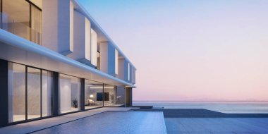 Günbatımında yüzme havuzu ve deniz manzaralı modern mimari
