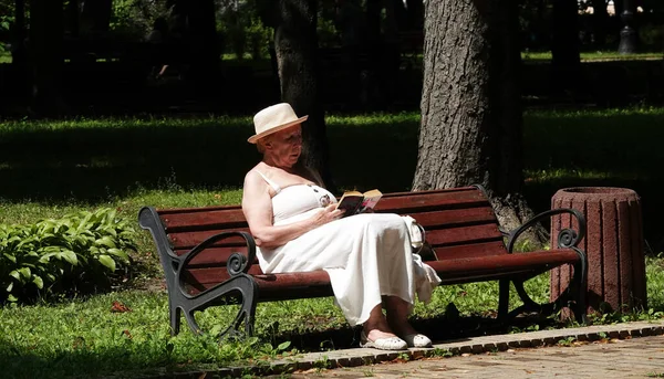 Kiev Ukraine July 2021 Grandmother Sits Park Bench Reads Book Royalty Free Stock Photos
