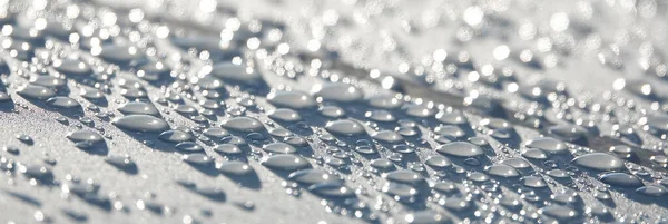Fundo Gotas Água Uma Superfície Branca Com Brilho Sol — Fotografia de Stock