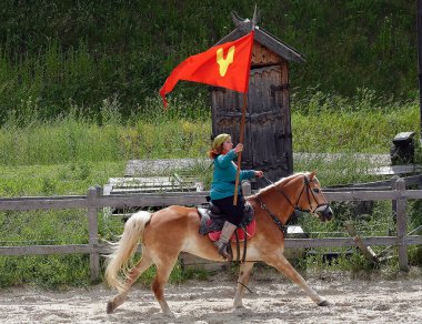 Kiev, Ukraine June 19, 2021: show in the entertainment complex Kievskaya Rus - Beautiful rider on a horse in an old outfit