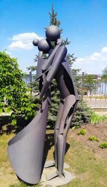 Kiev, Ukraine May 05, 2018: Iron sculpture of a man and woman hugging