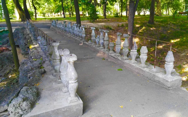 abandoned old bridge in the park in summer