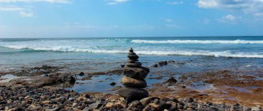 Canary Islands, Spain March 24, 2013: seashore with a cairn for meditation