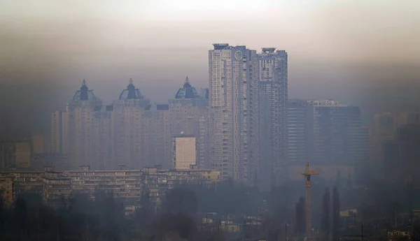 Kiev, Ukraine January 8, 2020: Strong black smog over the buildings and quarters of Kiev