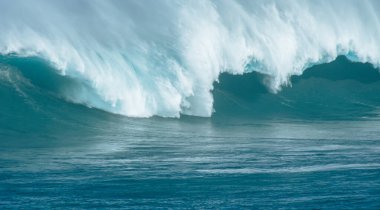 Sport photography. Jaws swell on International surfing event in Maui, Hawai 2021 December. clipart