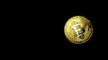 Siyah arkaplan üzerinde Bitcoin döndürme.