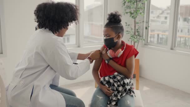 African American Doctor Applying Plaster Child Shoulder Being Vaccinated Opening — Vídeos de Stock