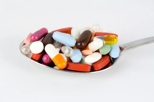 Tabletki na łyżkę — Zdjęcie stockowe
