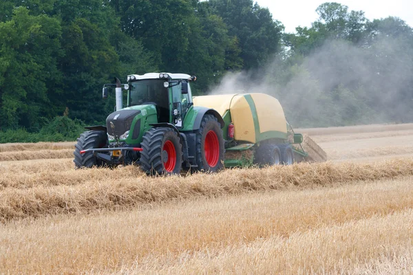 Harvesting - straw bale press — Stock Photo, Image