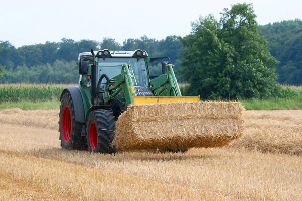 Tractor with bales of straw — Stock Photo, Image