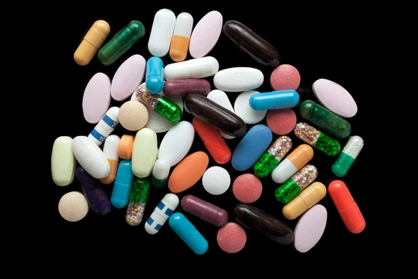 Pills on black — Stock Photo, Image