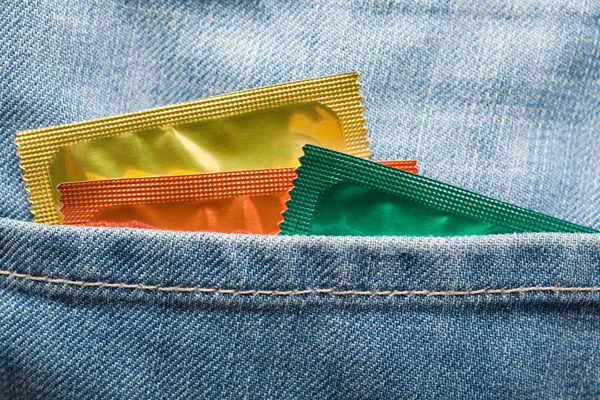 Condoms in pocket — Stock Photo, Image