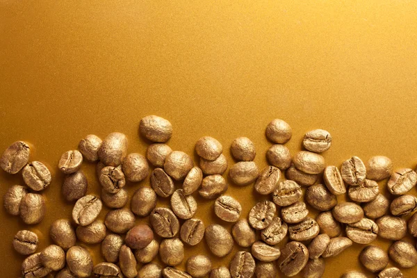 Gouden koffie bonen — Stockfoto