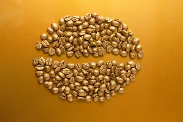 Złote ziarna kawy — Zdjęcie stockowe