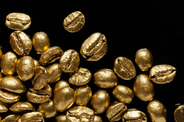 Golden cafe - coffee beans — Stock Photo, Image