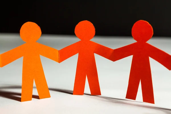 Paper team linked together partnership concept — Stock Photo, Image