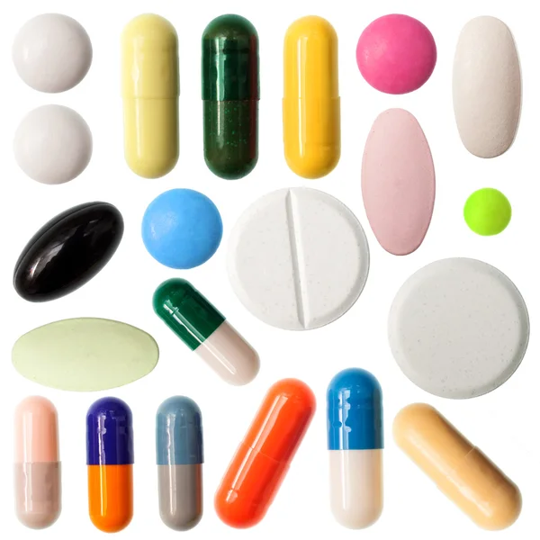 Pills and capsules on white background — Stock Photo, Image