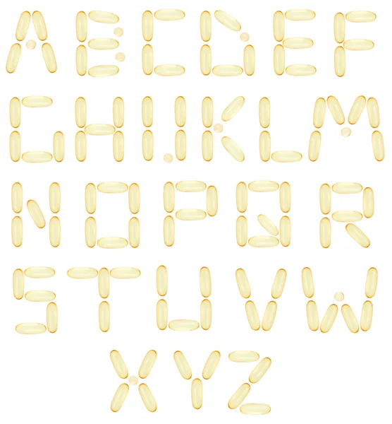 Alphabet with fish oil capsules — Stock Photo, Image