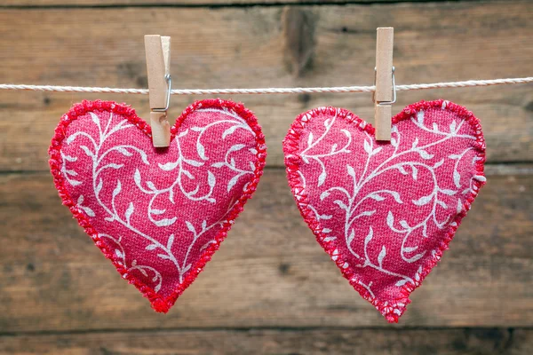 Red hearts hanging on the clothesline — Stock Photo, Image