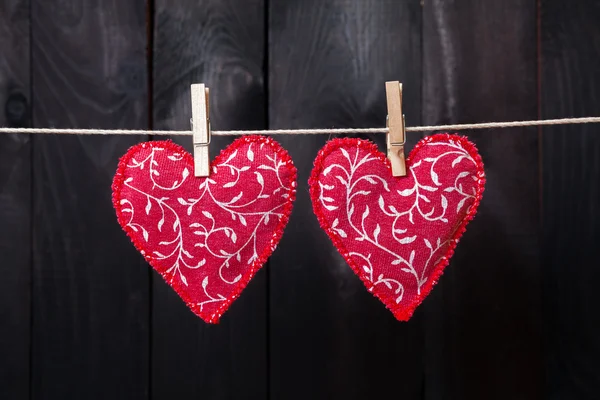 Red hearts hanging on the clothesline — Stock Photo, Image