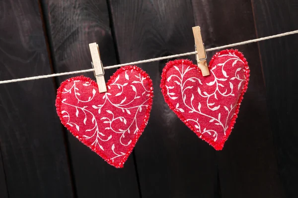 Red hearts hanging on the clothesline — Stock Photo, Image