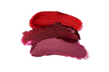 Kırmızı, pembe ve bordo renkli kozmetik lekeleri. Beyaz renkte izole edilmiş..