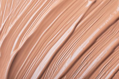 Sıvı fondöten, bej rengi. Kozmetik arka plan..