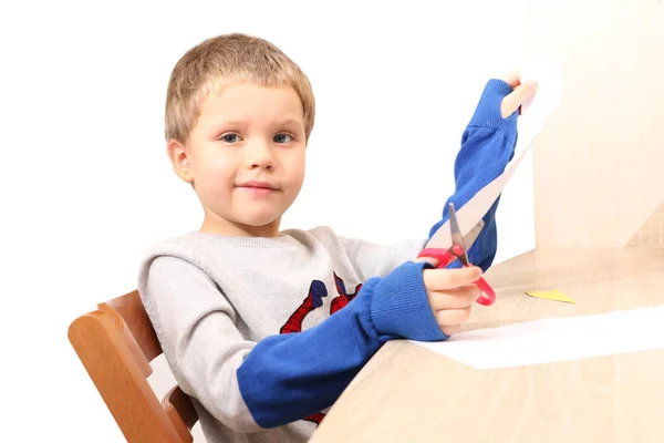 Cute Preschool Boy Sitting Table Show Blank Paper Sheet Home — Stock Photo, Image