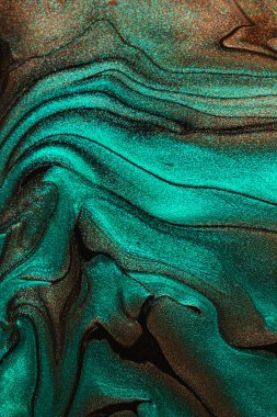 Işıldayan tırnak törpüsü, çikolata ve turkuaz renklerin soyut arkaplanı. Dikey yönelim..