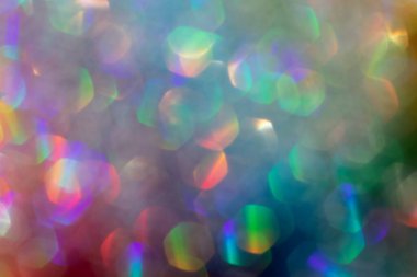 Soyut odaklanmış çok renkli arkaplan, parlayan ışıltıyla. Kaplama tabakası kadar iyi..