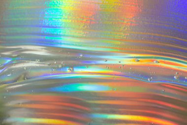 Holografik arkaplanda soyut kozmetik jel var. Kozmetik afiş kadar iyi..