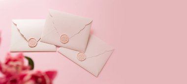 Photography from above of group of gift certificates.Tender pink color,banner with copy space.