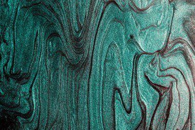 Elegant marble turquoise background,make from liquid nail polishes.Good as cosmetics backdrop.