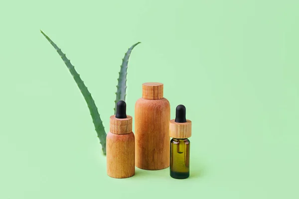 Group of wooden cosmetics tubes with aloe vera on background.Organic cosmetic concept.