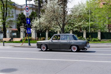 Bucharest, Romania, 24 April 2021 Old retro black Romanian Dacia 1100 classic car in traffic in a street in a sunny spring day