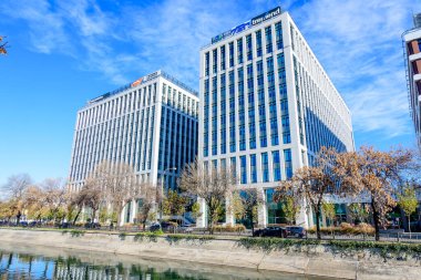 Bucharest, Romania, 20 Nov 2021: Modern glass business buildings at Timpuri Noi area with headquarters of Platika, Tremend, Zitec in a sunny autumn day