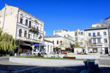 Bucharest, Romania, 20 November 2021: Old buildings with bars and restaurants on Lipscani Street (Strada Lipscani) in the historical center (Centrul Vechi) in a sunny autumn day