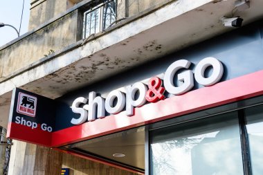 Bucharest, Romania, 6 November 2021: Entry sign with logo for a small Mega Image Shop and Go supermarket in a sunny autumn day