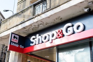 Bucharest, Romania, 6 November 2021: Entry sign with logo for a small Mega Image Shop and Go supermarket in a sunny autumn day