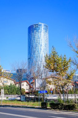 Bucharest, Romania, 21 Nov 2021: Modern glasss building of Sky Tower in Aurel Vlaicu neighborhood in a sunny autumn day
