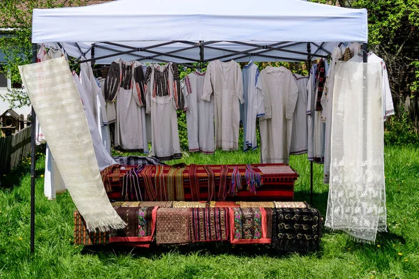 Traditional Romanian hand made clothes displayed for sale at a hand made festival in Bucharest, Romania